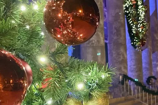 A Christmas tree decorated outside of the Sidney and Berne Davis Art Center