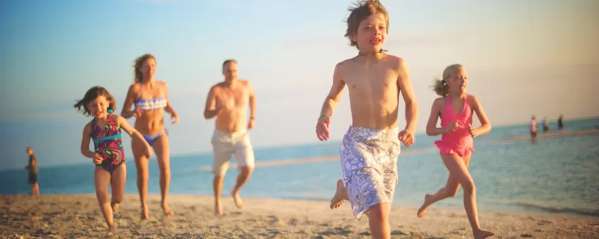 Kids running on beach